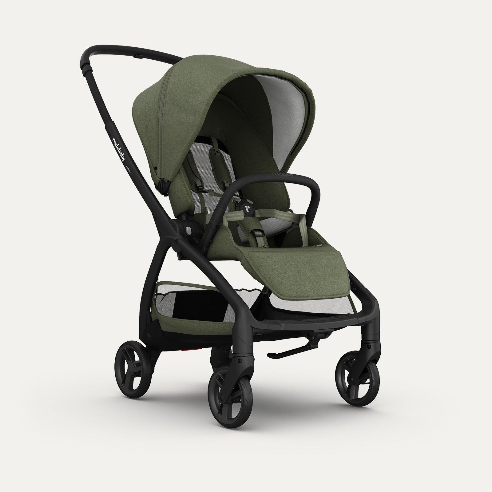 A green Redsbaby Aeron stroller with a sleek black frame. The stroller features a large canopy, comfortable seat with a harness, adjustable footrest, and spacious storage basket underneath. The design is modern and functional, with an elegant green fabric providing a stylish touch. A green Redsbaby Aeron stroller with a sleek black frame. The stroller features a large canopy, comfortable seat with a harness, adjustable footrest, and spacious storage basket underneath. The design is modern and functional, with an elegant green fabric providing a stylish touch.