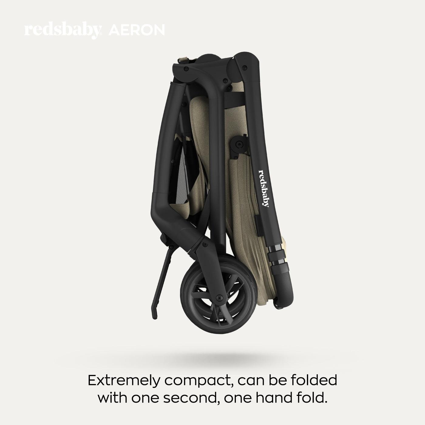 A folded taupe-colored Redsbaby Aeron stroller with a black frame, showcasing its compact design. The image highlights the stroller's ability to be folded quickly and easily with one hand in just one second. The text reads 'redsbaby AERON' at the top and 'Extremely compact, can be folded with one second, one hand fold.' at the bottom. A folded taupe-colored Redsbaby Aeron stroller with a black frame, showcasing its compact design. The image highlights the stroller's ability to be folded quickly and easily with one hand in just one second. The text reads 'redsbaby AERON' at the top and 'Extremely compact, can be folded with one second, one hand fold.' at the bottom.