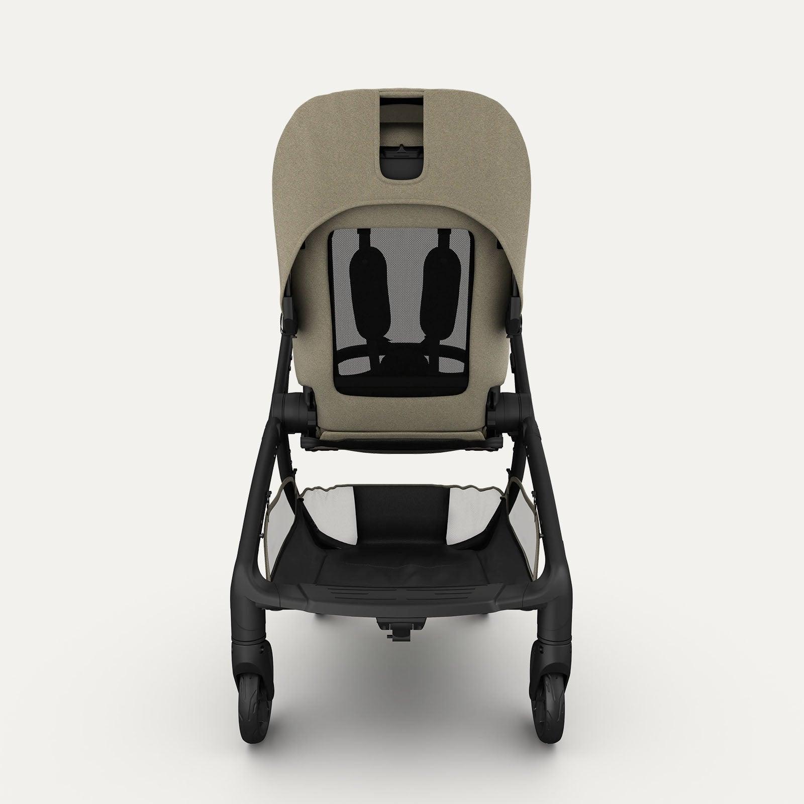 Rear view of the taupe-colored Redsbaby Aeron stroller with a black frame. The image highlights the mesh back panel for ventilation, the adjustable harness system, and the spacious storage basket underneath the seat. The stroller is designed for comfort and practicality. Rear view of the taupe-colored Redsbaby Aeron stroller with a black frame. The image highlights the mesh back panel for ventilation, the adjustable harness system, and the spacious storage basket underneath the seat. The stroller is designed for comfort and practicality.