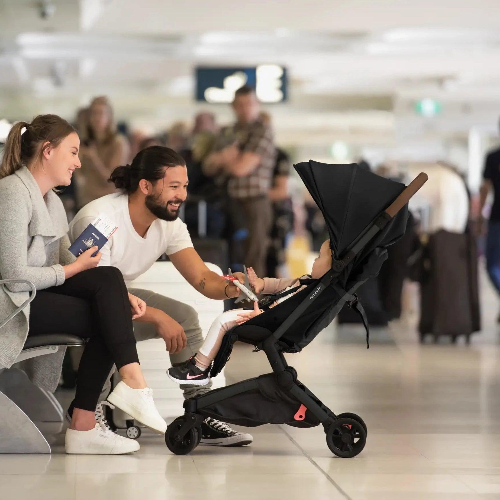 Redsbaby SKIP² black stroller in a hero shot, ideal for travel and urban adventures.