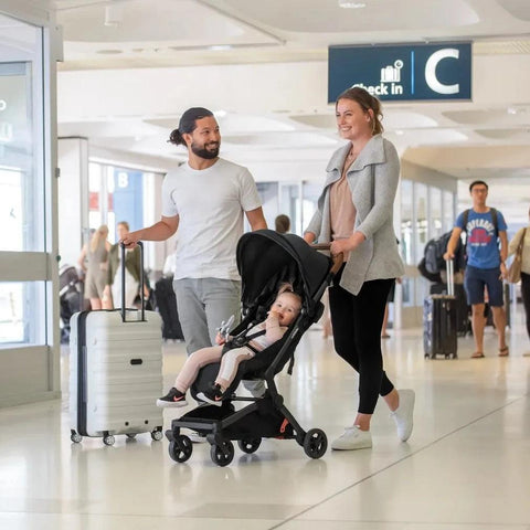 Redsbaby SKIP² in black, demonstrating easy folding and suitability for on-the-go families.