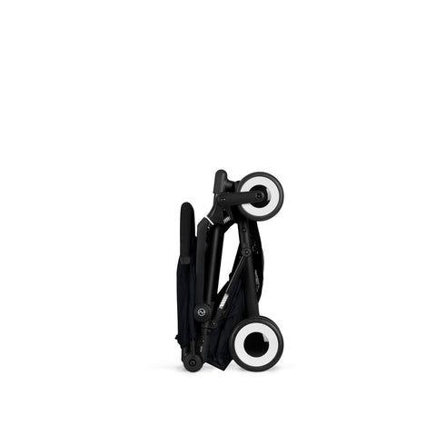 Magic Black cybex agis stroller folded on a white background