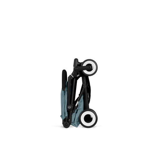 Stormy Blue cybex agis stroller folded with wheels on a white background
